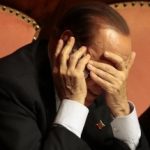Italian center-right leader Silvio Berlusconi uses a mobile phone during a confidence vote at the Senate in Rome, October 2, 2013. Berlusconi promised to support Prime Minister Enrico Letta in a confidence vote on Wednesday, staging a U-turn only days after he provoked a crisis by pulling his ministers out of the government. Berlusconi abruptly changed course as dozens of rebels in his centre-right People of Freedom party prepared to vote for Letta. REUTERS/Tony Gentile (ITALY - Tags: POLITICS) - RTR3FII7