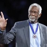 Celtics' legend Russell stands with his Presidential Medal of Freedom during the NBA All-Star basketball game in Los Angeles