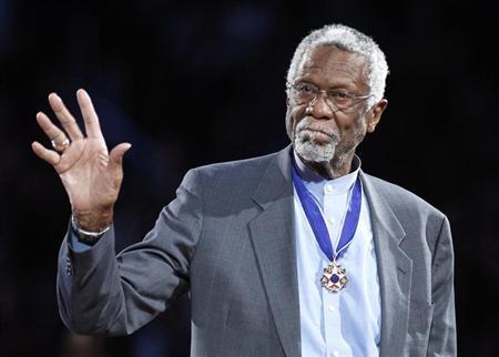 Celtics' legend Russell stands with his Presidential Medal of Freedom during the NBA All-Star basketball game in Los Angeles