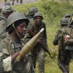 Congolese soldiers move to frontline positions as they advance against the M23 rebels in Kibumba