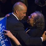 U.S. Senate candidate Cory Booker hugs his mother Carolyn after delivering a speech during his campaign's election night event in Newark, New Jersey