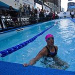 U.S. long-distance swimmer Nyad takes a breath during her 48 hour continuous swim at Herald Square in New York