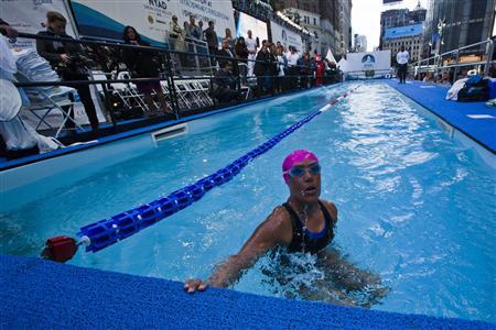 U.S. long-distance swimmer Nyad takes a breath during her 48 hour continuous swim at Herald Square in New York