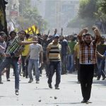 Clashes between supporters of Mohamed Mursi and anti Mursi protesters during march in Shubra street in cairo