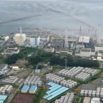 An aerial view shows TEPCO's tsunami-crippled Fukushima Daiichi nuclear power plant and its contaminated water storage tanks in Fukushima