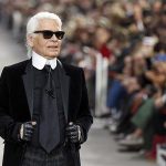 German designer Karl Lagerfeld appears at the end of his Spring/Summer 2014 women's ready-to-wear fashion show for French fashion house Chanel during Paris fashion week
