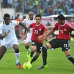 Ghana's Asamoah Gyan, left, battles with Egypt's Mohamed Naguib and Ahmed Shedid, right