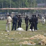 Indian National Security Guard commandos inspect the site of a bomb blast in the eastern Indian city of Patna