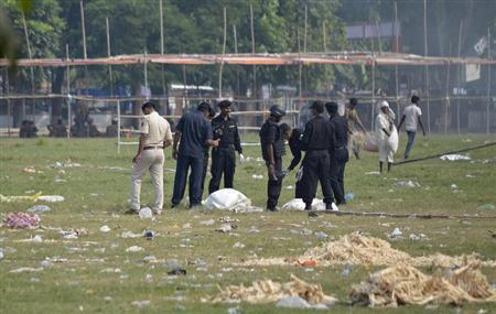 Indian National Security Guard commandos inspect the site of a bomb blast in the eastern Indian city of Patna