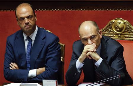 File photo of Italy's Prime Minister Letta looking on next to Interior Minister Alfano during a vote session at the Senate in Rome