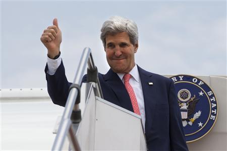 U.S. Secretary of State Kerry makes the thumbs up sign as he leaves, after completing his trip to Malaysia, from Subang TUDM outside of Kuala Lumpur