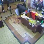 A CCTV video still shows what appears to be soldiers carrying plastic shopping bags as they leave the Nakumatt supermarket in the Westgate shopping mall in Nairobi