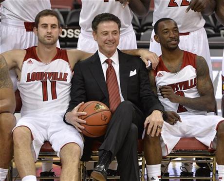 Louisville's Luke Hancock, left, head coach Rick Pitino, center, and Russ Smith