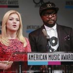 Kelly Clarkson and Will.i.am speak during announcement of 2013 American Music Awards nominations press conference in New York