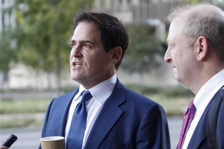 Cuban, the billionaire owner of the NBA's Dallas Mavericks, speaks with the media while his attorney Best looks on prior to entering U.S District Court for the opening day of his insider trading trial in Dallas