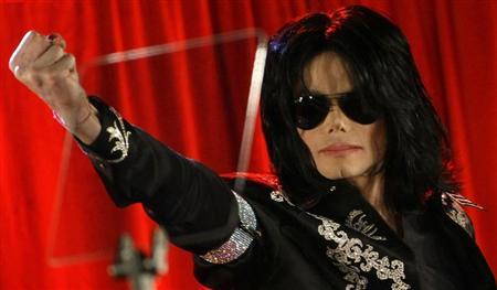 U.S. pop star Michael Jackson gestures during a news conference at the O2 Arena in London