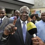 Mozambique's opposition RENAMO Presidential candidate Afonso Dhlakama shows an ink dyed finger after voting in the country's Presidential, Parliamentary and Provincial Elections in Maputo