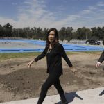 Argentine President Fernandez walks ahead of Lower House candidate Insaurralde in Buenos Aires