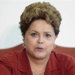 Brazil's President Rousseff reacts during a meeting with Renschler, head of production and procurement at Mercedes-Benz Cars, in Brasilia