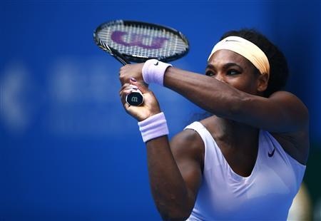 Serena Williams of the U.S. returns the ball during her match against Maria Kirilenko of Russia at the China Open tennis tournament in Beijing