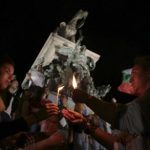 Students light candles
