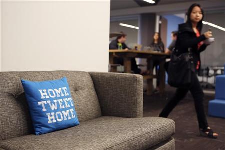 A pillow is placed on a couch at Twitter headuiarters in San Francisco
