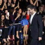 US designer Marc Jacobs appears at the end of his Spring/Summer 2014 women's ready-to-wear fashion show for French fashion house Louis Vuitton during Paris fashion week