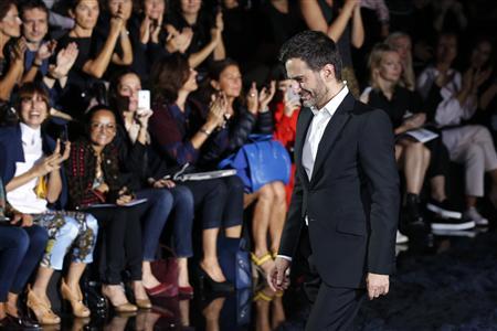 US designer Marc Jacobs appears at the end of his Spring/Summer 2014 women's ready-to-wear fashion show for French fashion house Louis Vuitton during Paris fashion week