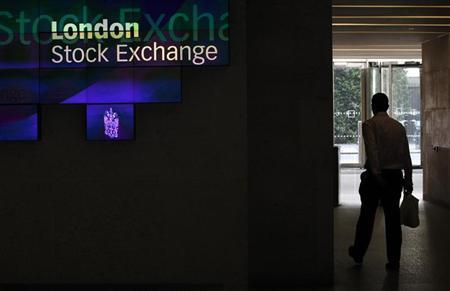 A man walks through the lobby of the London Stock Exchange