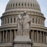 The statue of Grief and History stands in front of the Capitol Dome in Washington