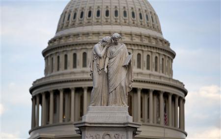 The statue of Grief and History stands in front of the Capitol Dome in Washington