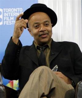 Author James McBride gestures during the "Miracle at St. Anna" news conference at the 33rd Toronto International Film Festival
