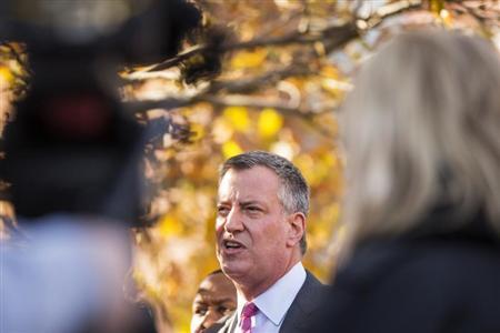 Democratic New York City mayoral candidate Bill de Blasio speaks to the media outside campaign stop in New York