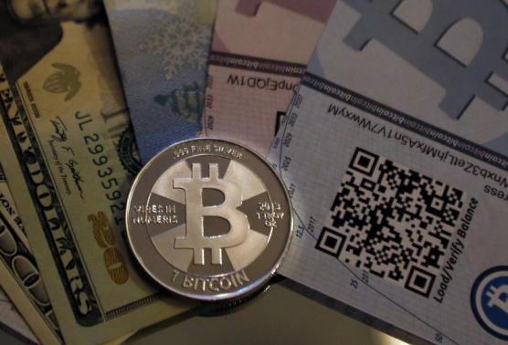 One of Bitcoin enthusiast Mike Caldwell's coins in this photo illustration at his office in Sandy, Utah