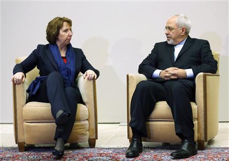 EU foreign policy chief Ashton talks with Iranian Foreign Minister Zarif during photo opportunity before the start of three days of closed-door nuclear talks at the UN in Geneva