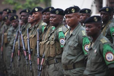 Congolese peacekeepers from the Multinational Force of Central Africa (FOMAC) listen to morning instructions from their commander at the FOMAC base in Bossangoa