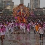 Devotees pull an idol of Hindu elephant god Ganesh
