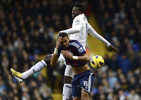 Tottenham Hotspur's Emmanuel Adebayor challenges Stoke City's Steven N'Zonzi during their English Premier League soccer match at White Hart Lane in London