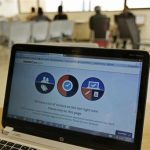 A busy screen is shown on the laptop of a Certified Application Counselor as he attempted to enroll an interested person for Affordable Care Act insurance in Miami