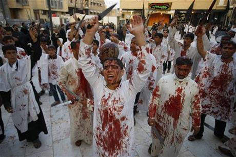 Iraqi Shiite faithful worshippers cut themselves with knives during Muharram