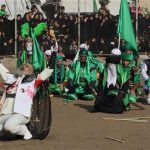 Iraqi Shiite faithful worshippers re-enact the seventh century battle of Karbala