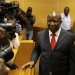 Malema, current leader of the EFF political party, gestures at Polokwane High Court
