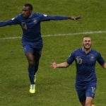 France's Benzema celebrates after scoring the second goal for the team during their 2014 World Cup qualifying second leg playoff soccer match against Ukraine at the Stade de France in Saint-Denis near Paris