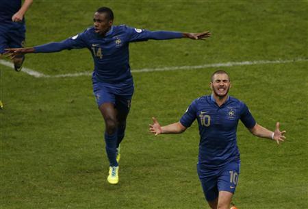 France's Benzema celebrates after scoring the second goal for the team during their 2014 World Cup qualifying second leg playoff soccer match against Ukraine at the Stade de France in Saint-Denis near Paris