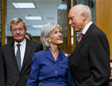 Kathleen Sebelius, center, Orrin Hatch, Max Baucus