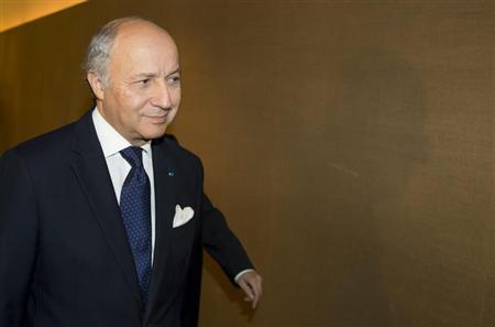 French Foreign Minister Laurent Fabius makes his way to a meeting during the third day of closed-door nuclear talks at the Intercontinental Hotel in Geneva