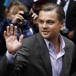 Actor DiCaprio waves to supporters as he arrives for a photocall to promote the movie "Shutter Island" at Berlinale in Berlin