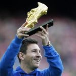 Barcelona's soccer player Lionel Messi poses with the Golden Boot trophy before their Spanish first division league match against Granada at Camp Nou stadium in Barcelona