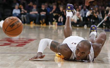 Los Angeles Lakers Kobe Bryant dives for a loose ball during their NBA game against the Chicago Bulls in Los Angeles