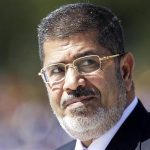 Egypt's President Mohamed Mursi reviews the troops in an official ceremony before a meeting with Brazil's President Dilma Rousseff at the Planalto Palace in Brasilia